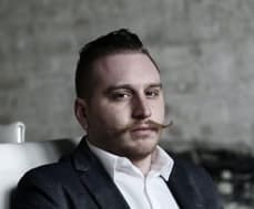 buzz cut with a handlebar mustache