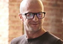 shaved head paired with glasses