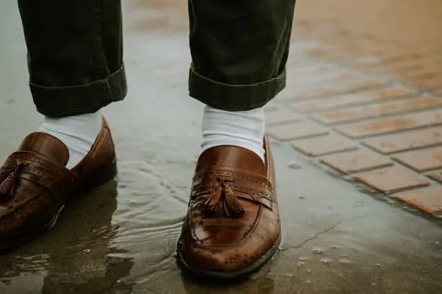 cuffed jeans and brown tassel loafers