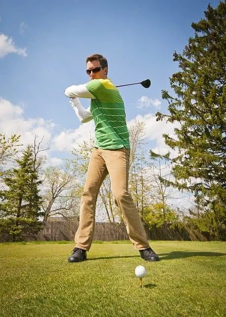 Man in chinos playing golf