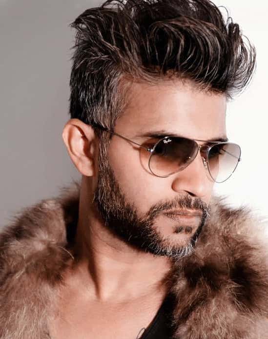 Messy pompadour with salt and pepper beard