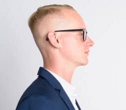 blond crew cut and glasses