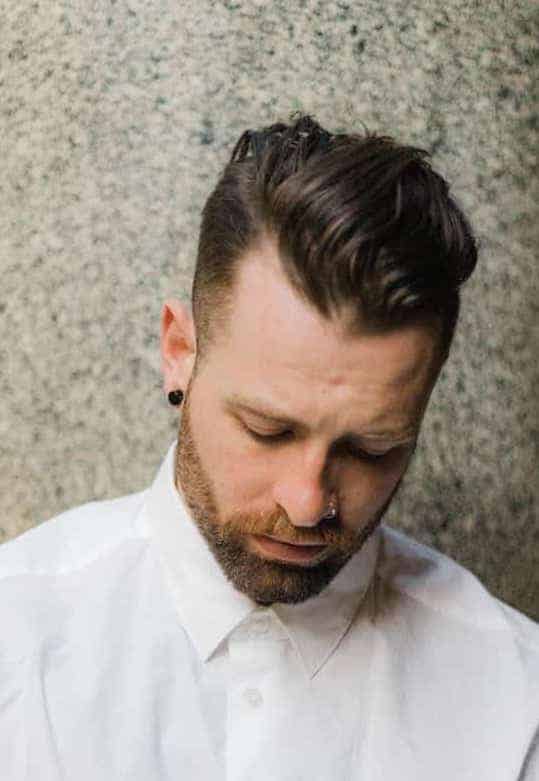 Finger combed pompadour with an undercut