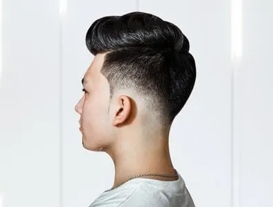 side view of pompadour with low fade