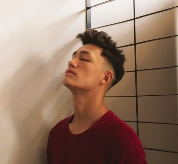 A textured quiff with a low fade