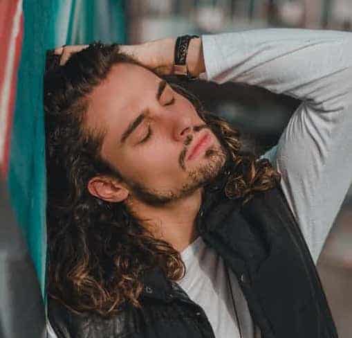 Long curly hair with goatee and chinstrap