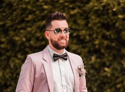 Wavy quiff with a mid fade
