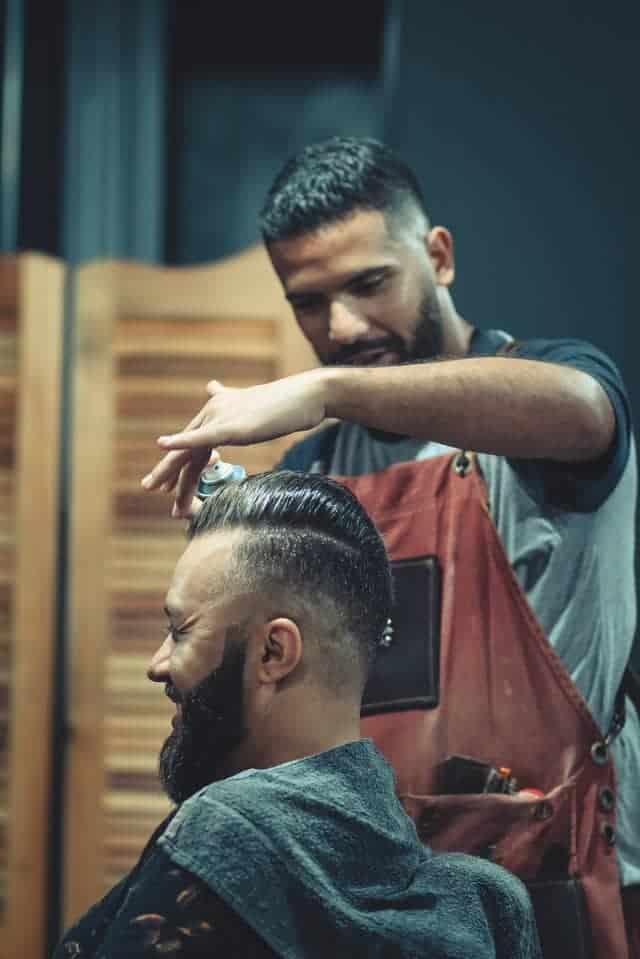 neat pompadour with undercut and hard parting