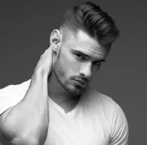 Wavy pompadour with a low fade