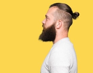 neat manbun with undercut and beard