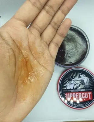 example of the uppercut deluxe pomade on the palm