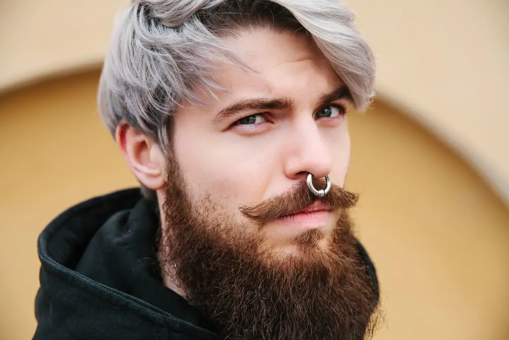 Man with a septum piercing