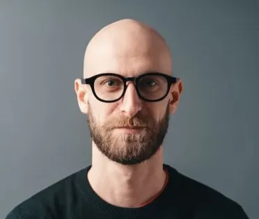 shaved head with beard and glasses