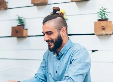 Top knot undercut and beard