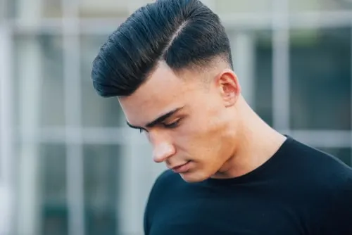 Brushed pompadour with side part