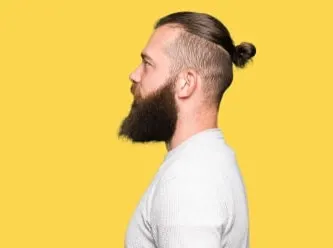 neat man bun undercut with beard