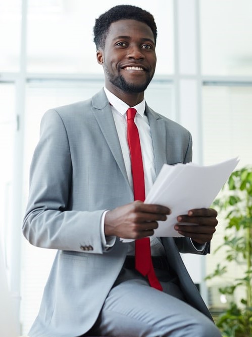 grey suit and red tie