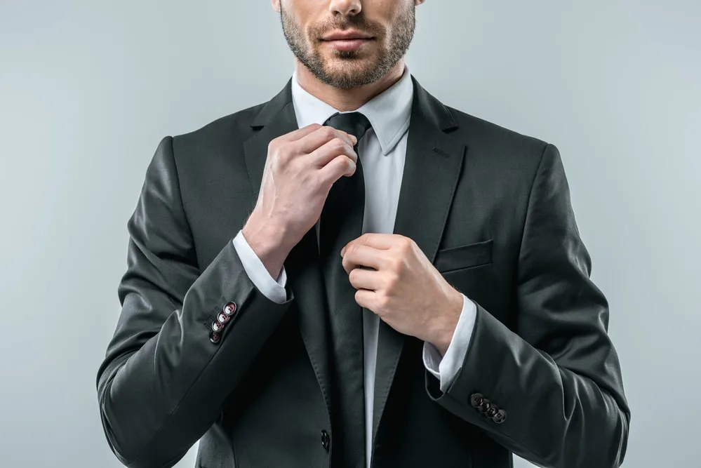 man in a charcoal grey suit