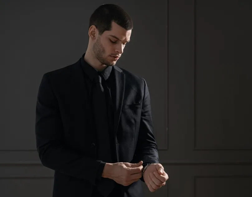 black shirt and suit 