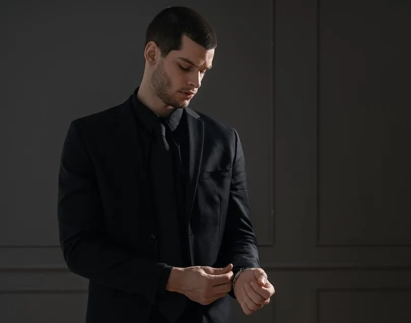 black shirt and suit