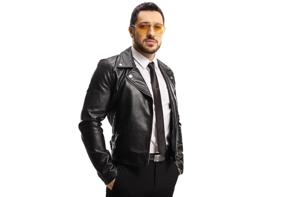 leather jacket over black suit