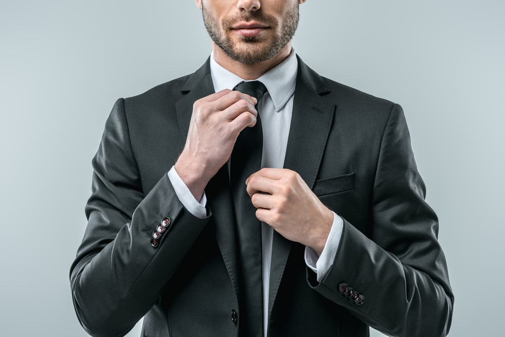 man in a charcoal grey suit 