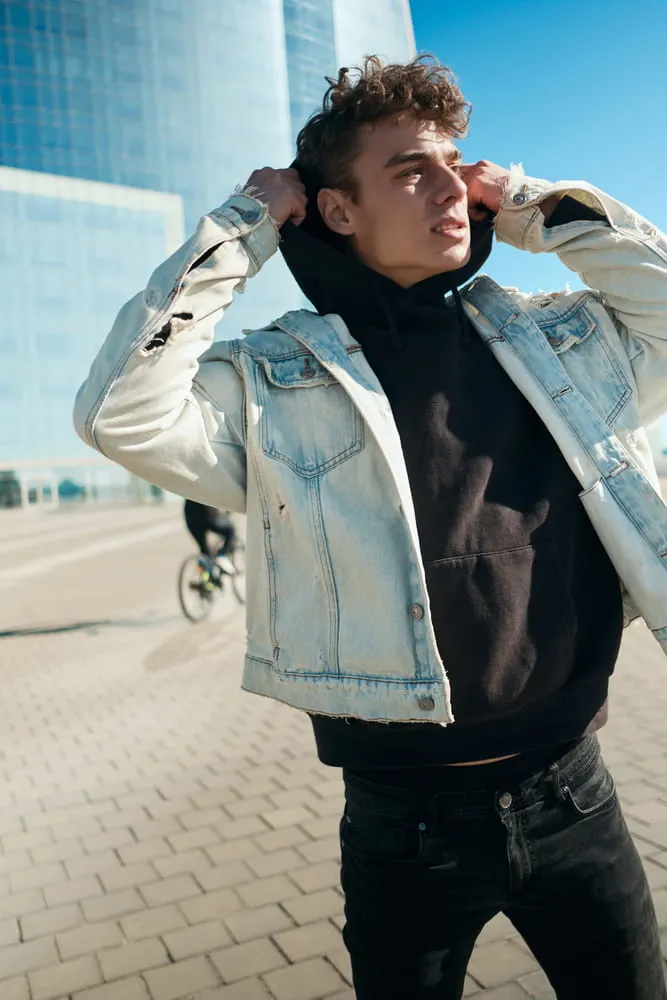 blue denim jacket and black jeans