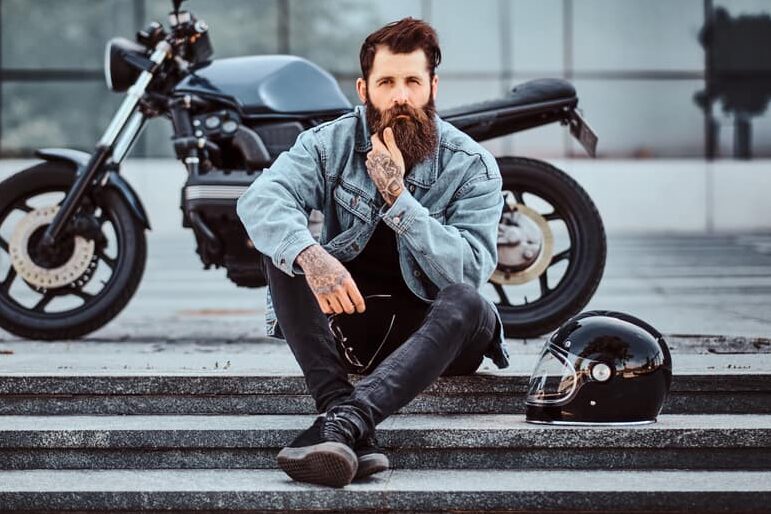 man in blue denim jacket and black jeans