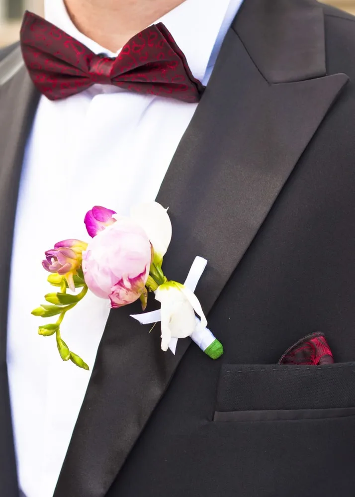 tuxedo with dark red bow tie