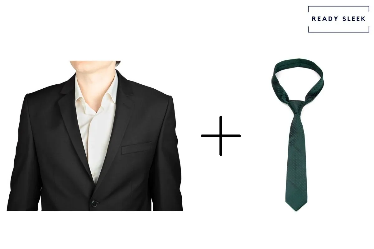 Black suit and white shirt with forest green tie