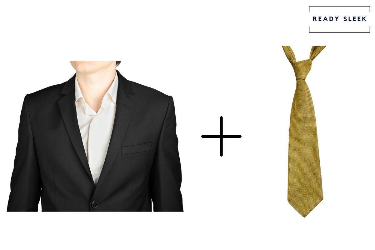 black suit and white shirt with gold tie