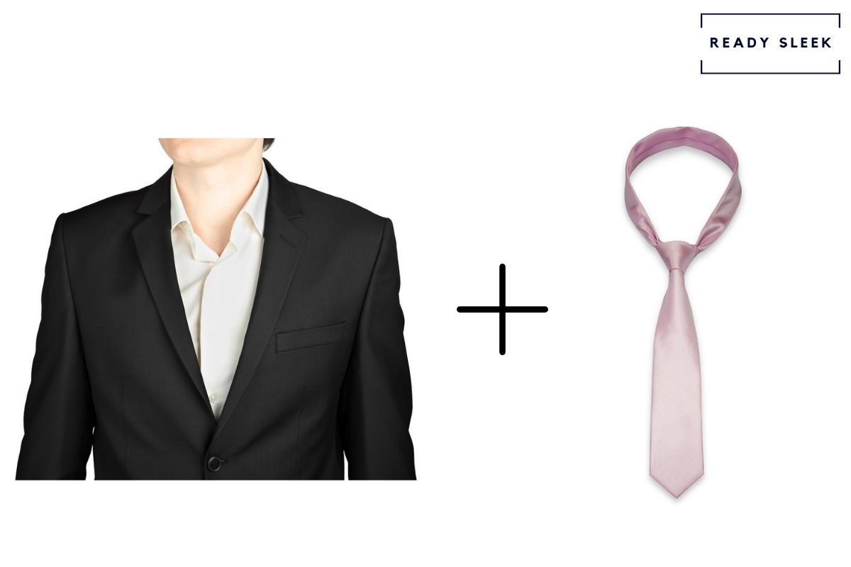 black suit and white shirt with pink tie 