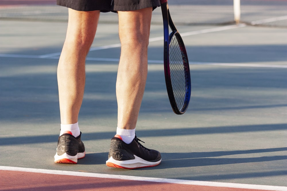 black sneakers and white socks