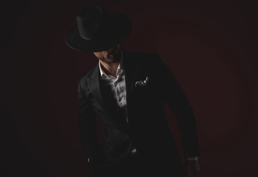 black suit and cowboy hat 