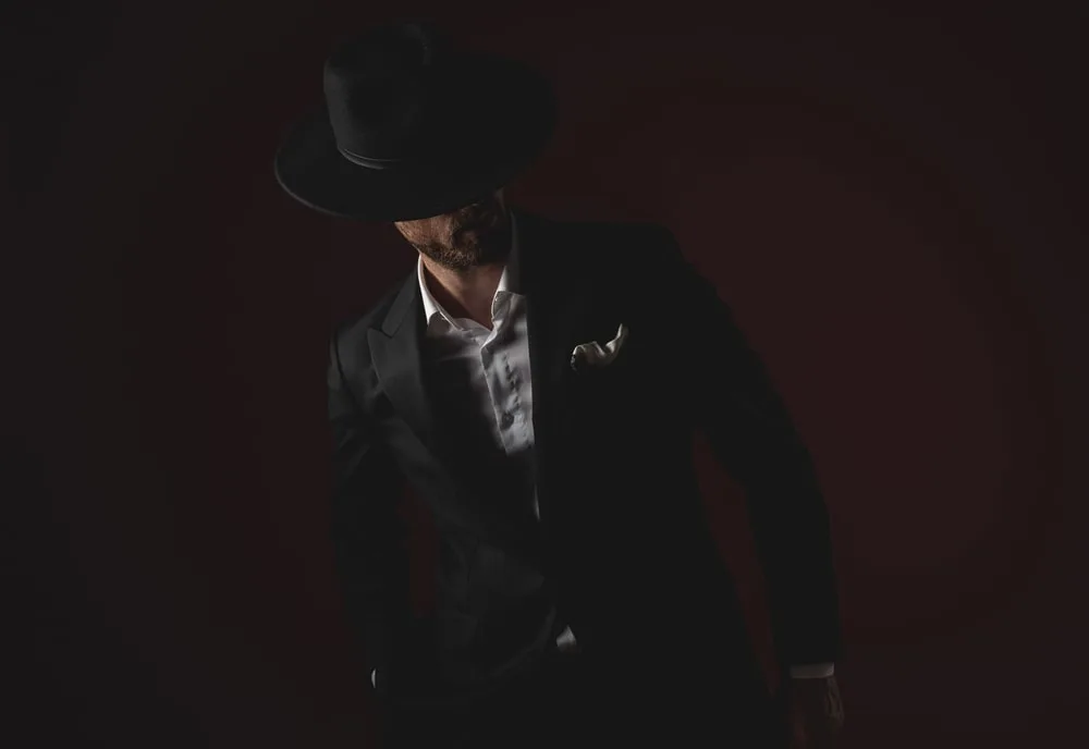 black suit and cowboy hat 