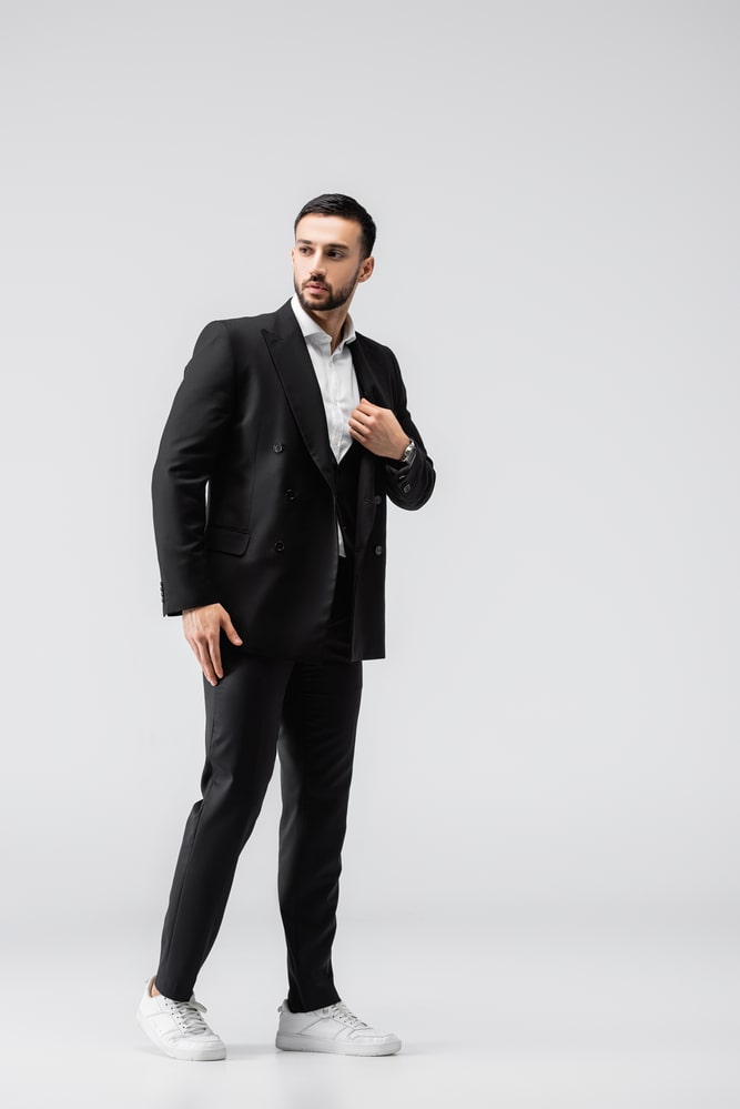 black suit with white shoes