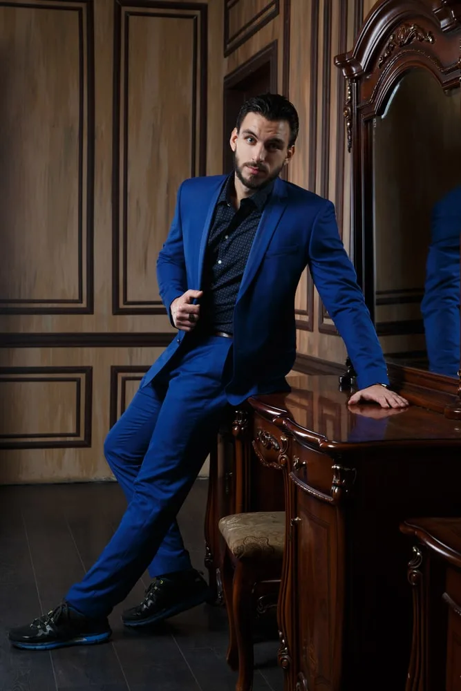 blue suit and black shirt