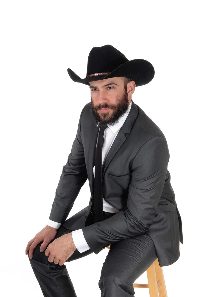 grey suit and cowboy hat