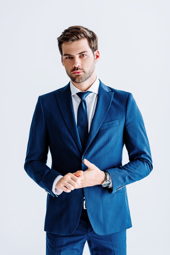 man in dark blue suit and tie