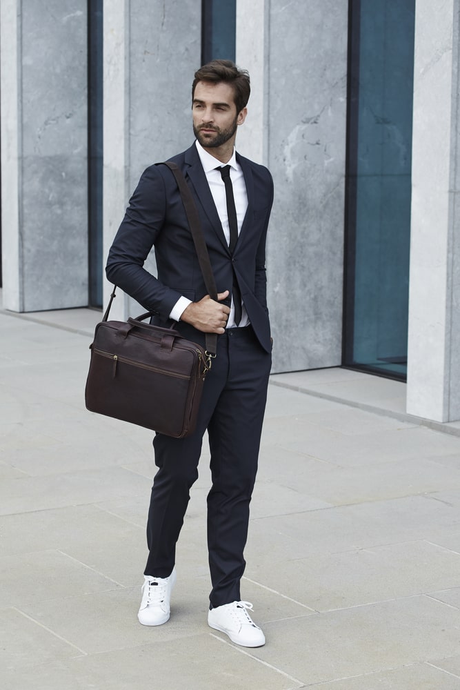 black suit and tie with white shoes