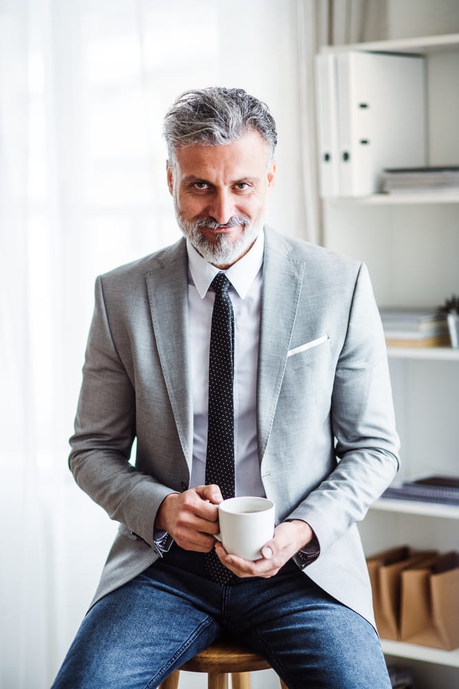 dress shirt with tie and jeans