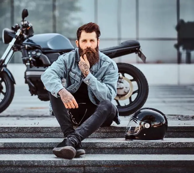 man in blue denim jacket and black jeans 