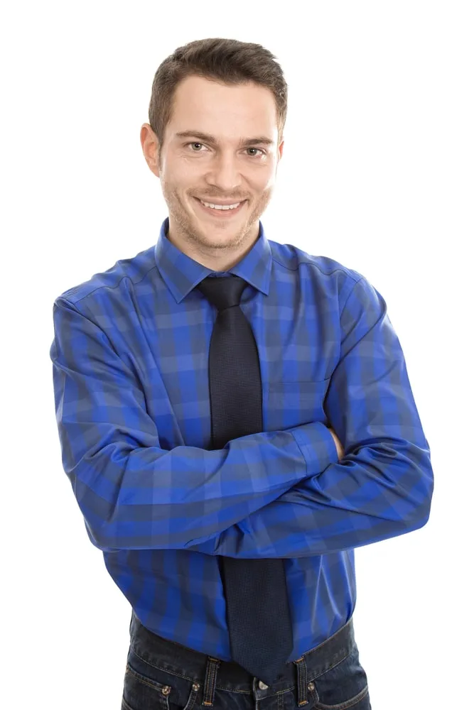 man in plaid shirt and tie