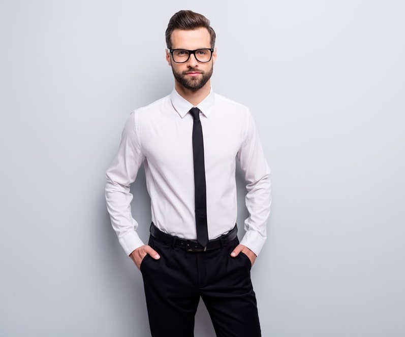 Man in white dress shirt and black pants leaning on gray concrete wall  photo  Free Grey Image on Unsplash