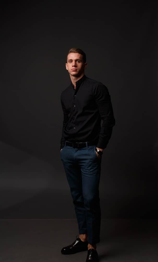 black shirt with navy pants and black shoes