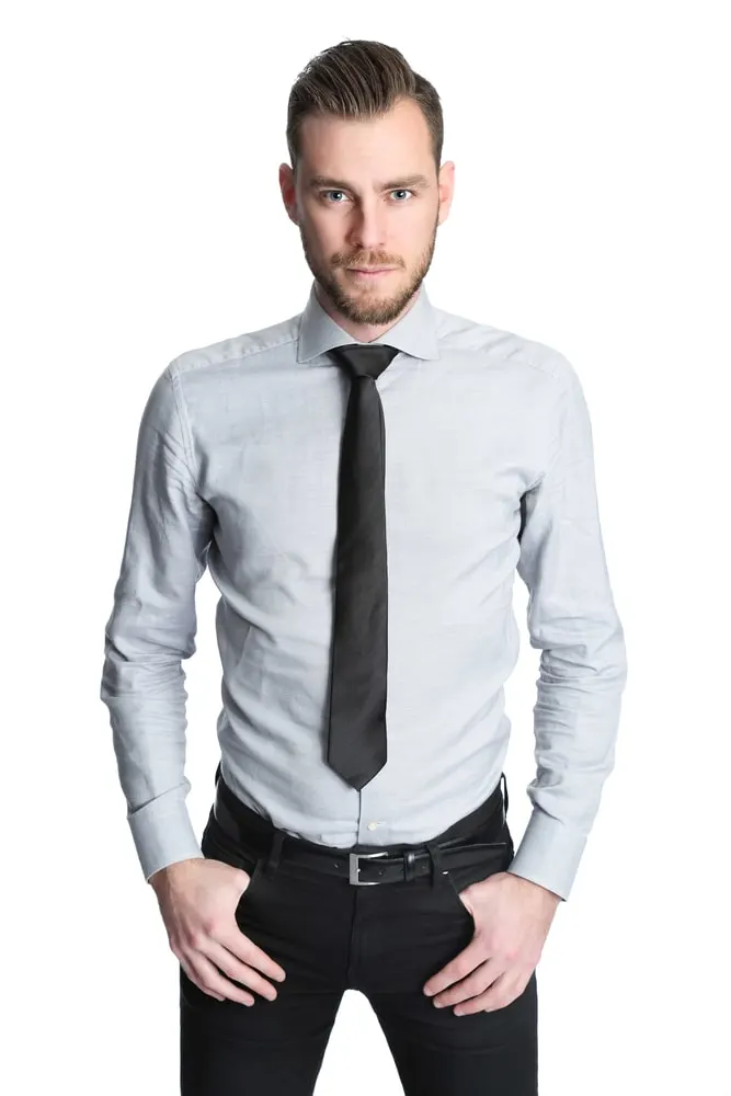 man in grey shirt and black tie