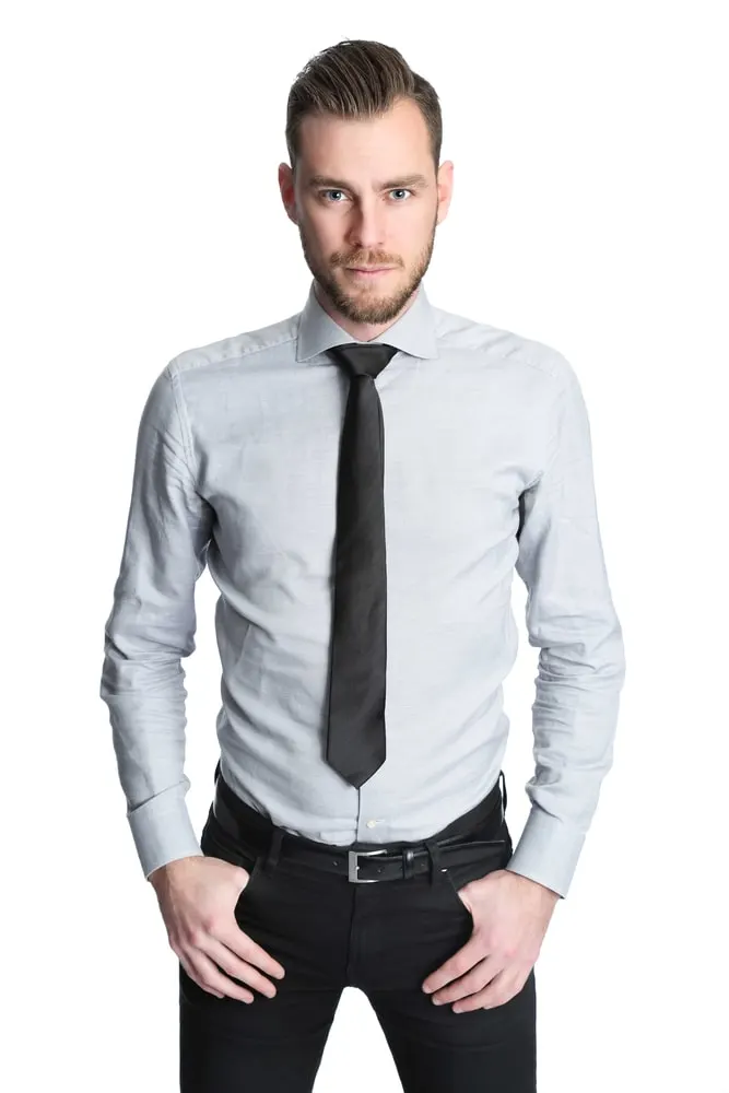 man in grey shirt and black tie 