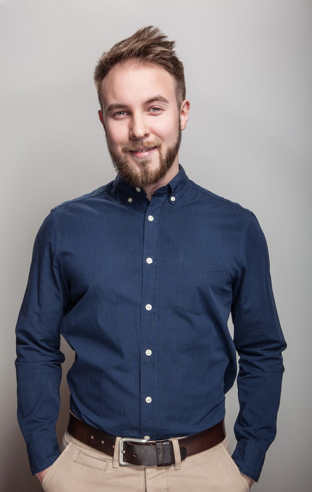 man in navy blue shirt and khaki pants