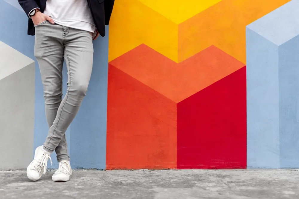 white sneakers and grey jeans