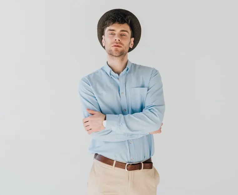 blue shirt with beige pants 